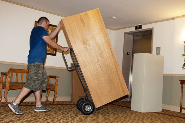 It is not easy to move furniture into an apartment.